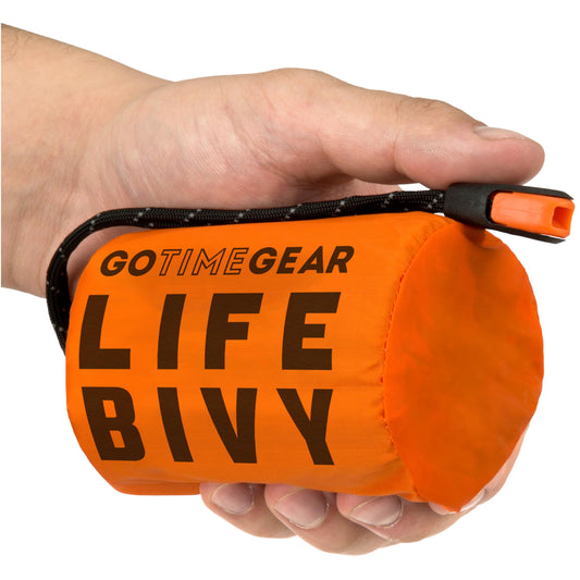 Go Time Gear Lightweight Bivy Sack - Emergency Bivy with 120 dB Whistle & Paracord - Thermal Emergency Blanket for Survival Kit - Compact for Camping & Backpacking Gear - Pack of 1, Orange